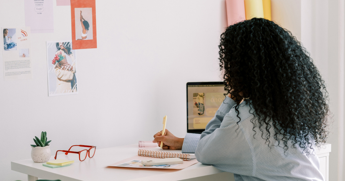Woman working at home office desk