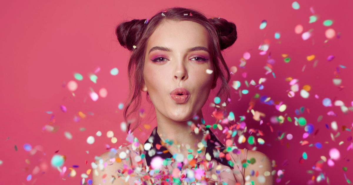 Woman celebrating with confetti